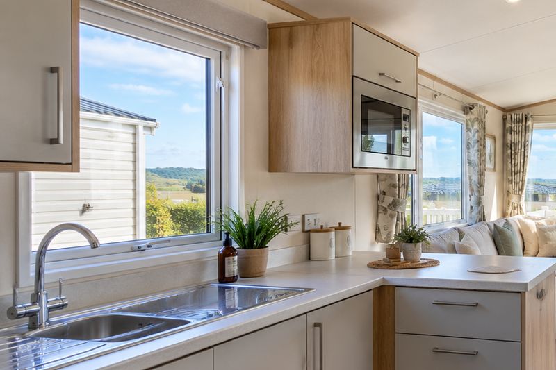 Static caravan kitchen with a window view